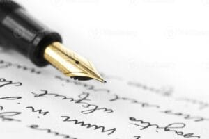 or-stylo-sur-main-lettre-ecrite